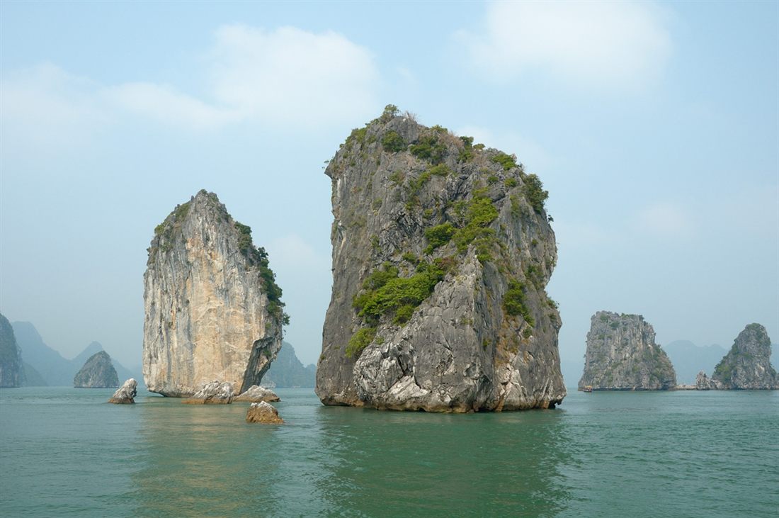 Limestone karsts rising from the water in Ha Long Bay, Vietnam