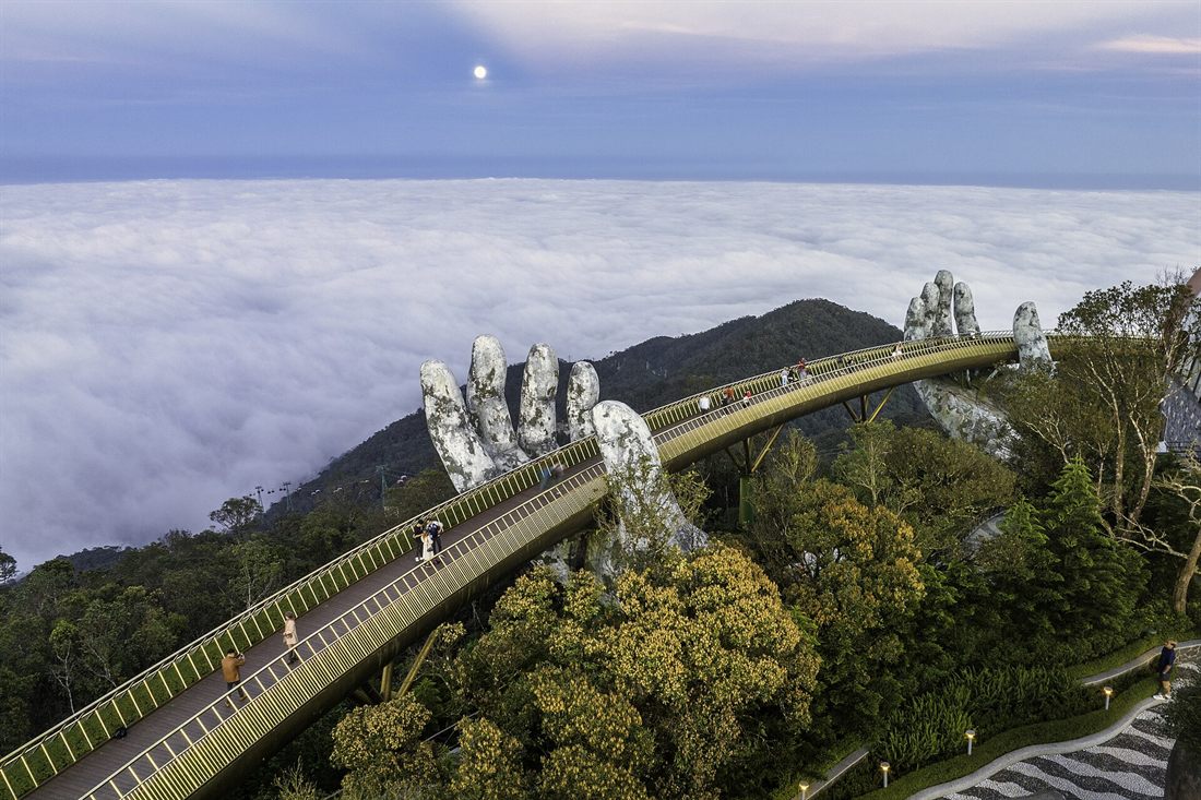 The Golden Bridge held by giant stone hands above the clouds near Da Nang